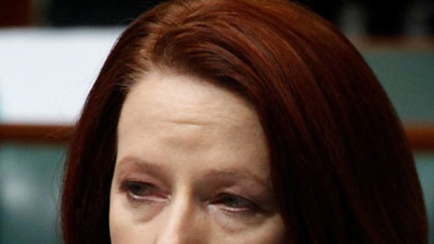An emotional Julia Gillard holds back tears as she speaks about the human cost of the floods.