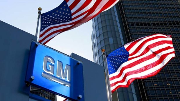 US flags fly outside the headquarters of General Motors in Detroit, Michigan.