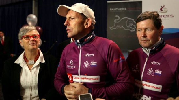 Tony Abbott dries out at Panthers club after a charity bike ride.