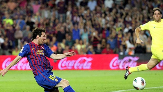 Lionel Messi scores for Barcelona during the La Ligue match against Villarreal.