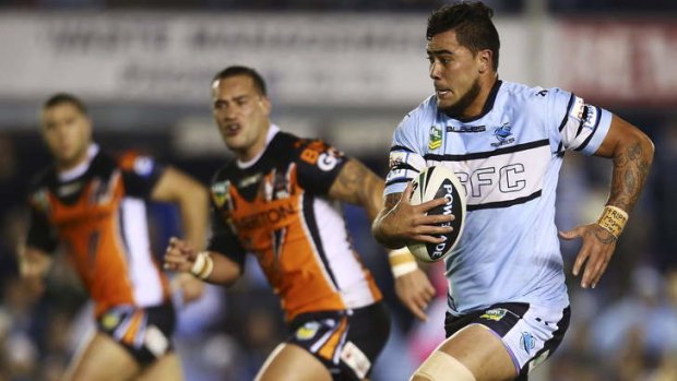 On the run: Andrew Fifita sprints to the line for a  try in Cronulla's win.