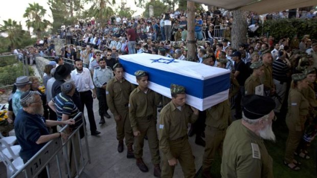 Israeli soldiers carry the coffin of Sergeant Barkay Shor, who was killed in fighting in Gaza.