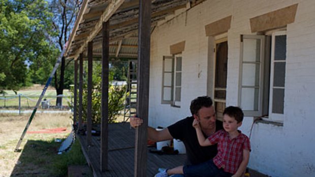 History ... Adrian Nesbitt and his son, Archie, 4, at the former family home built around 1815.
