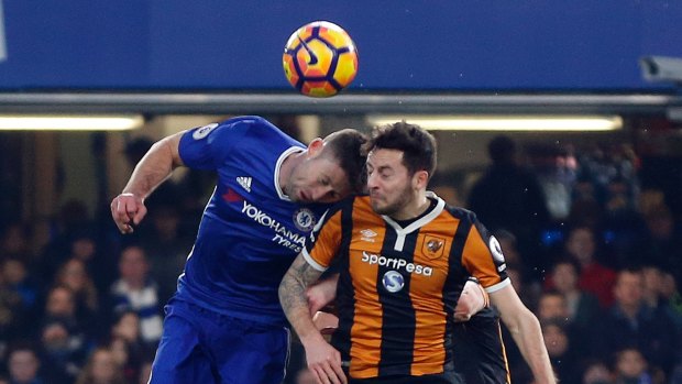 Brutal accident: Ryan Mason, right, clashes heads with Gary Cahill.