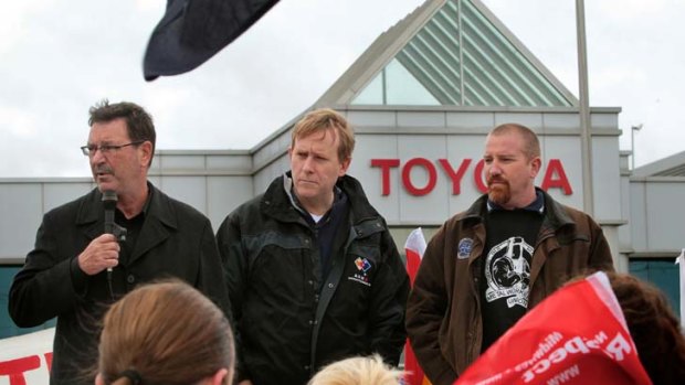 Protest ... AMWU union officials Dave Smith, Steve Dargavel and Leigh Diehm spoke outside the Toyota plant in Altona yesterday.