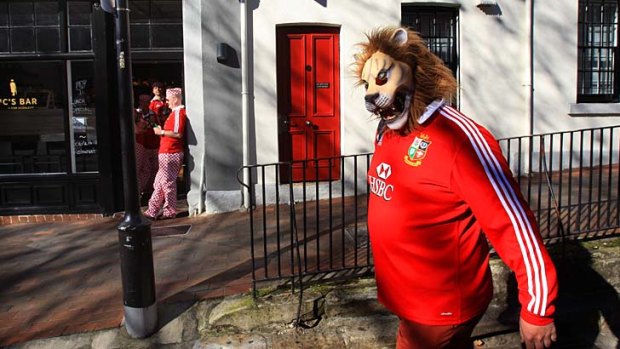Diehard fans: Lions supporters show their true colours.