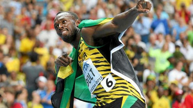 Usain Bolt celebrates with his traditional pose.