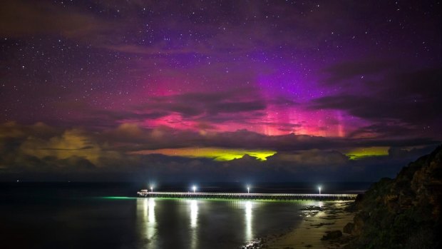 Sunday night's aurora australis peaking through a gap in cloudy conditions over Point Lonsdale Pier. 