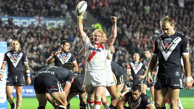 James Graham of England celebrates after going over for a try against New Zealand in Hull.