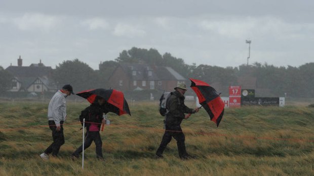 Hardy group: spectators brave the high winds, but play was abandoned.