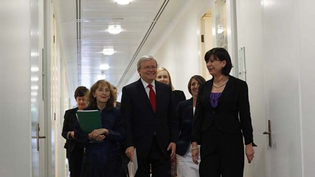 Kevin Rudd, surrounded by his supporters, leaves the caucus meeting after securing only 31 votes.