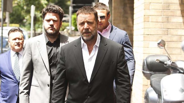 Well liked ... Russell Crowe attends the memorial which was held at Sydney Grammar School.