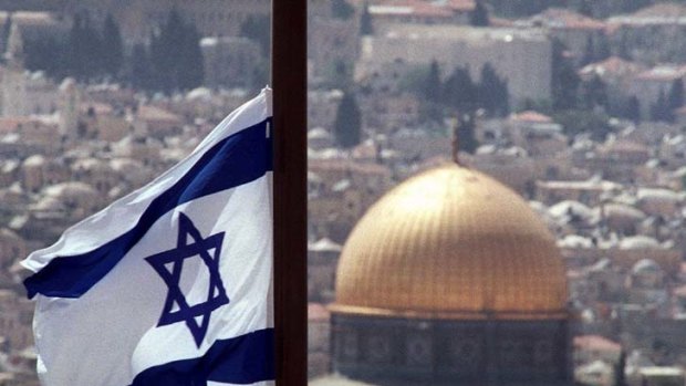 Israel's flag flies over the Dome of the Rock mosque in Jerusalem