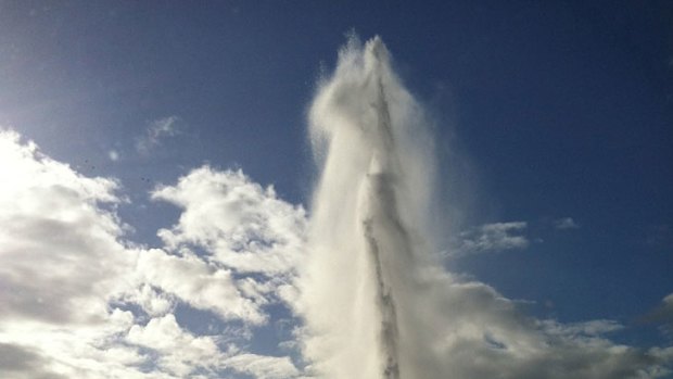 A burst water main causes water to shoot into the air in Tennyson.