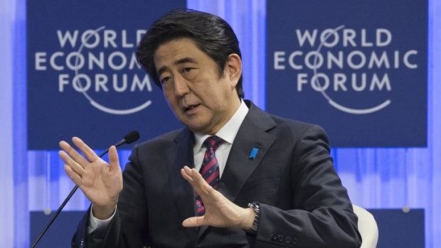 Japanese prime minister Shinzo Abe, gestures as he speaks at the World Economic Forum in Davos, Switzerland.