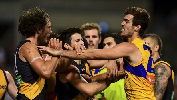 Scott Lycett was wearing the predominantly gold guernsey when he tussled with Tyrone Vickery.