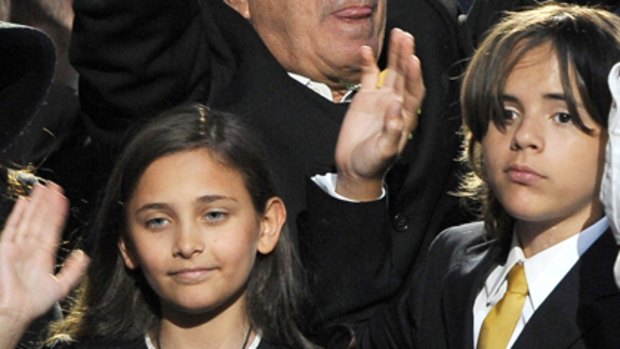 Not coping ... Paris Jackson, left, Prince Michael Jackson II (also known as Blanket), and Prince Michael Jackson I, right, pictured at their father's funeral.