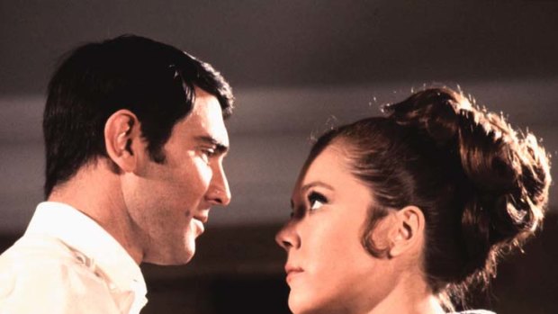 George Lazenby as James Bond with Diana Rigg in <i>On Her Majesty's Secret Service</i>.