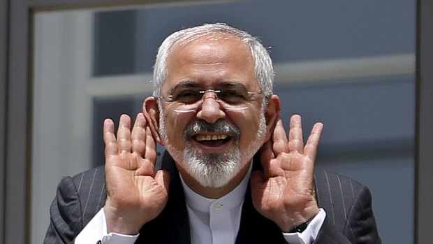 Iranian Foreign Minister Mohammad Javad Zarif gestures as he talks with journalists in Vienna where the deal was reached. 