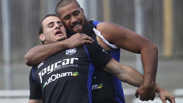 Up close and personal ... Frank Pritchard gets to grips with Josh Reynolds.