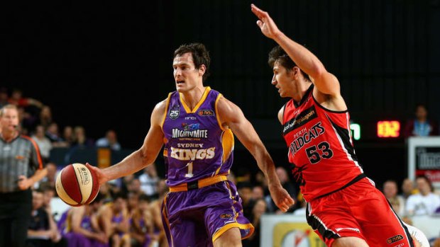 Ben Madgen of the Kings dribbles the ball during the round three NBL match between the Sydney Kings and the Perth Wildcats at Sydney Entertainment Centre.