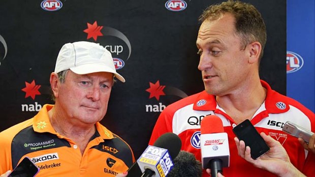 GWS coach Kevin Sheedy, pictured with Swans coach John Longmire, said the cap would exacerbate the downfalls of the stringent concussion rule.
