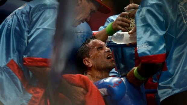 Anthony Mundine receives treatment from his corner during his match with Joshua Clottey.