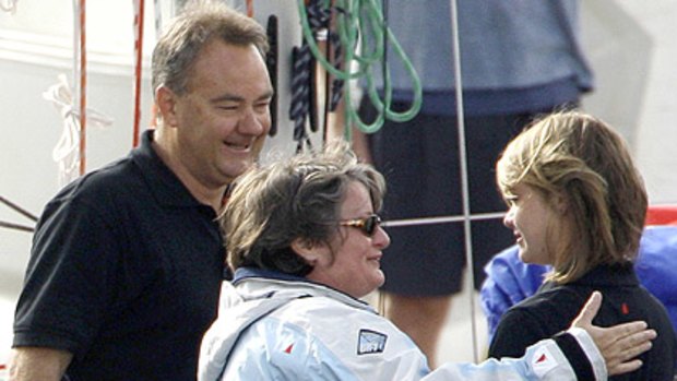 Tearful teenage sailor Jessica Watson, right, hugs her mother Julie as her father, Roger looks on.