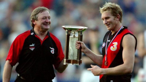 Winners are grinners: Kevin Sheedy and James Hird collect the AFL's Anzac Day trophy in 2003.