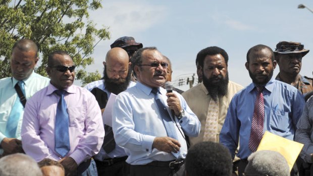 Power struggle ... Prime Minister Peter O'Neill, centre, addresses his supporters in Port Moresby earlier this year.