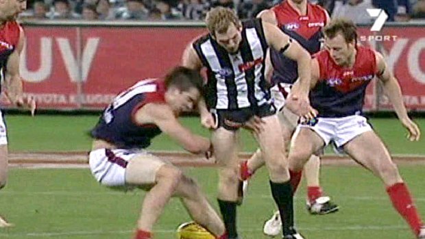 Collingwood's Ben Johnson crashes into Melbourne's Dannie Bell, knocking him unconscious, in 2007.