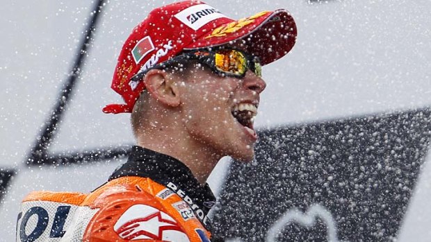 Going ... Casey Stoner celebrates on the podium after winning the Portuguese Grand Prix in Estoril on May 6.