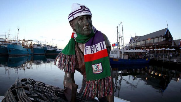 A statue on Fisherman's Landing is pictured wearing a Dockers scarf and beanie.