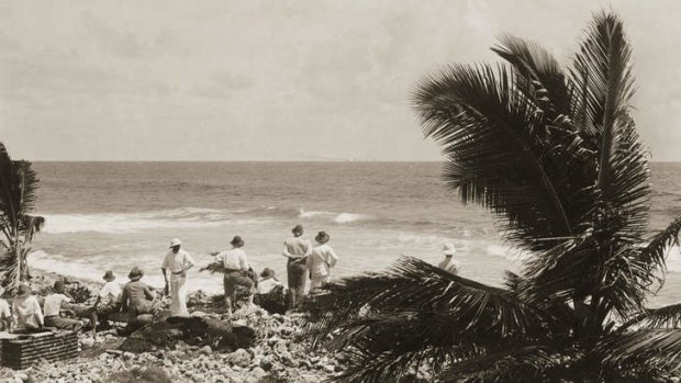 Islanders and members of the Emden watching the battle from the shore of Direction Island.