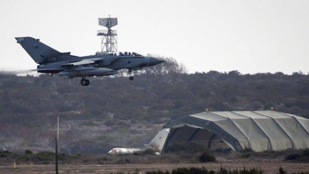 A British RAF tornado fighter jet prepares to land on an airstrip in Cyprus, at RAF Akrotiri, after returning from a mission over Iraq on September 27, 2014.