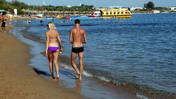 Tourists at Egypt's Sharm el Sheikh resort town. Some newly empowered Islamists have a message for foreign tourists: welcome to Egypt, but no booze, bikinis or mixed bathing at beaches, please.