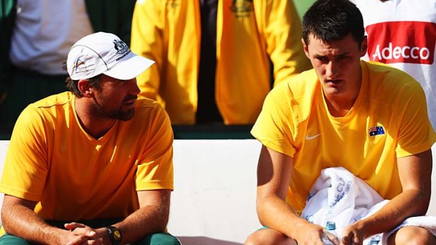 Tough love ... Pat Rafter has words with Bernard Tomic at the ill-fated Davis Cup world group play-off in September.