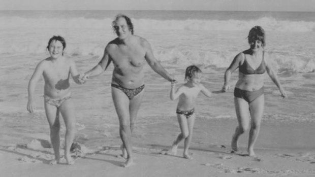 Good life: Ronnie Biggs enjoying the surf in Rio de Janeiro with his wife Charmian and two of their children.