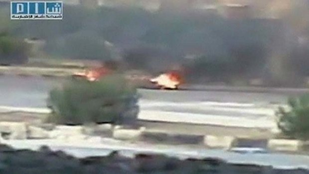 Smoke and fire are allegedly seen on a street in the city of Hama in this still image taken from video posted on a social media website on August 1, 2011.
