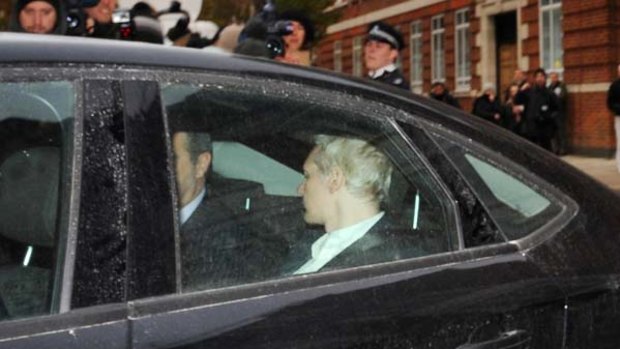 Julian Assange is driven to Westminster Magistrates Court in London.