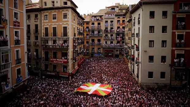 Huge crowds ... participants stand in front of the Town Hall of Pamplona, northern Spain.