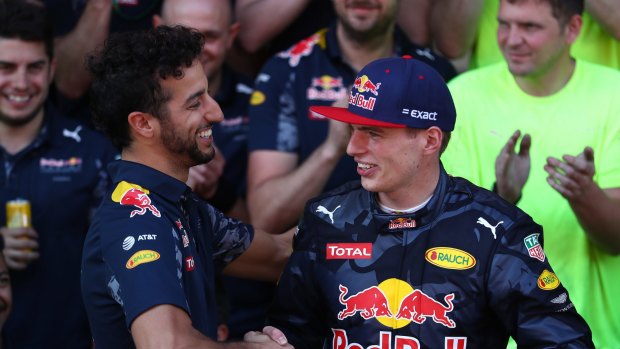 Daniel Ricciardo congratulates Red Bull teammate Max Verstappen after his debut win.
