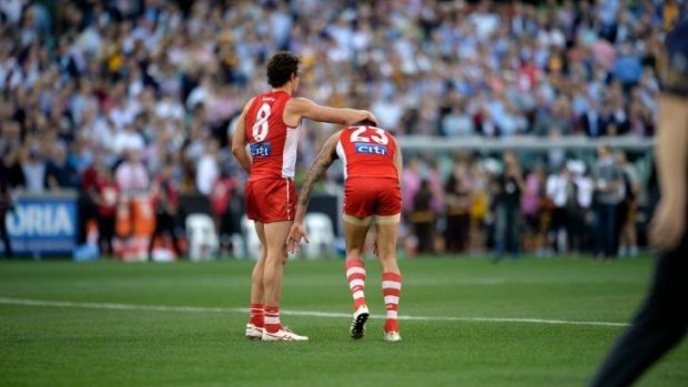 Sydney's key forwards commiserate after their grand final loss.