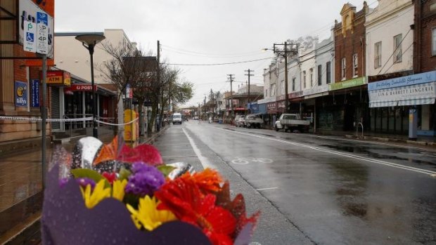Flowers are placed close to the explosion site in Rozelle as the main street remained closed on Saturday.