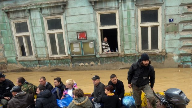 Local residents are evacuated from the town of Obrenovac, south-west of Belgrade.