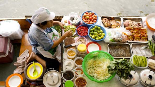 Live to eat ... a floating market vendor in Bangkok.