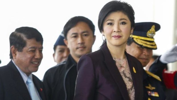 Thailand Prime Minister Yingluck Shinawatra arrives at the Royal Thai Air Force headquarters before a cabinet meeting in Bangkok.