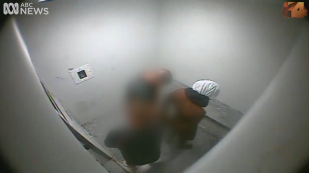 A boy handcuffed and hooded in an isolation cell of the Don Dale Youth Detention Centre near Darwin.