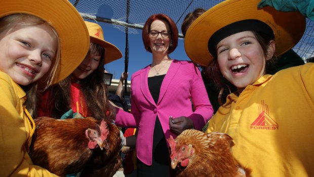 Prime Minister Julia Gillard meets children at Forrest Primary School in Canberra on Monday.