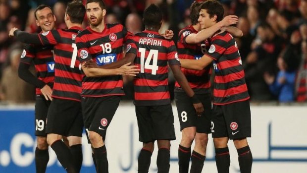 Expecting a frosty reception: The Wanderers celebrate their first leg win.